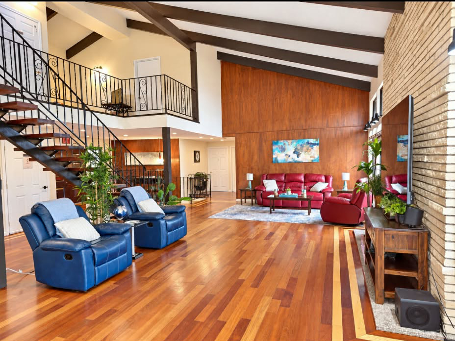 Spacious shared living room with vaulted ceiling